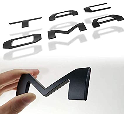 EMBLEMA LETRAS TOYOTA PARA TACOMA BATEA NEGRO 2016 - 2021 TRASERAS